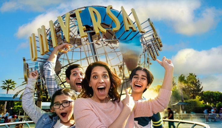 Family in front of Universal globe
