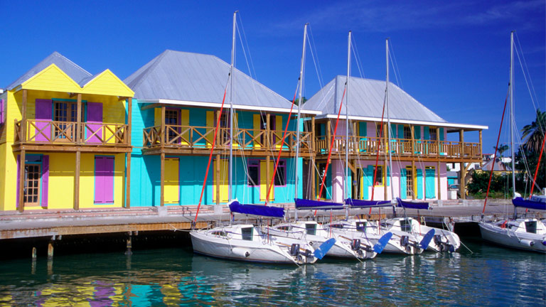 Colourful buildings near boat dock in Antigua