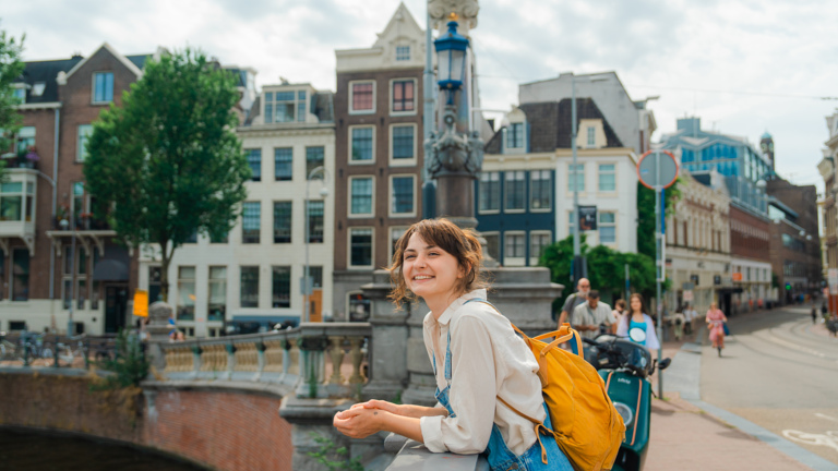 person enjoying Amsterdam canals